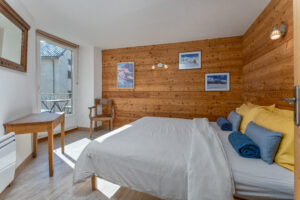 The bright and airy master bedroom with city view and its own private balcony for two